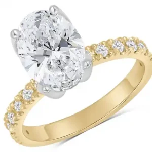 Bague Florence solitaire pavé diamant de laboratoire ovale 2.28cts serti fleur et diamants d'accent en or jaune et blanc 14K Commander Maintenant