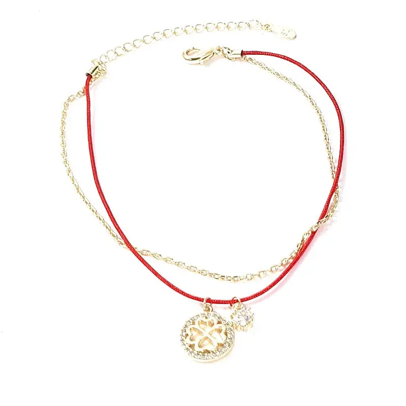 Bracelet souple breloques trèfle fil nylon rouge Prix Cassé