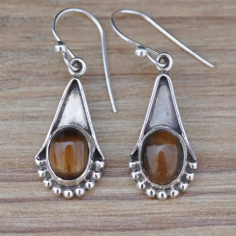 Boucles pierre Oeil de tigre ovale monture creuse en argent (brun) Retour Gratuit
