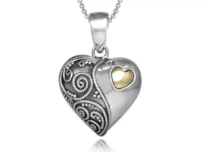 Édition Limitée Pendentif reliquaire coeur antique 18k or jaune et lobe décoré de volutes en argent